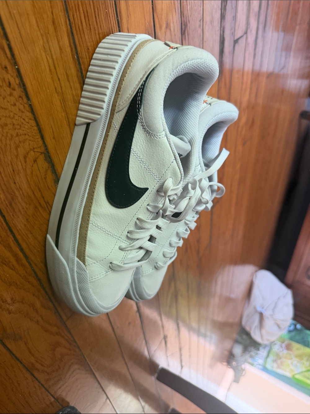 Nike Cream Leather Sneakers with Black Swoosh and Tan Stripe